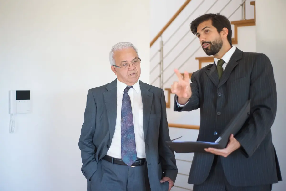 An estate agent showing a property to a buyer